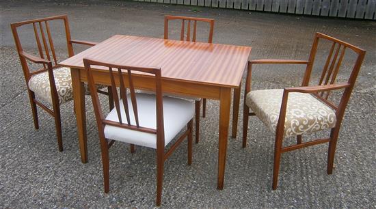 A Gordon Russell teak extending dining table and six chairs (4+2 carvers)